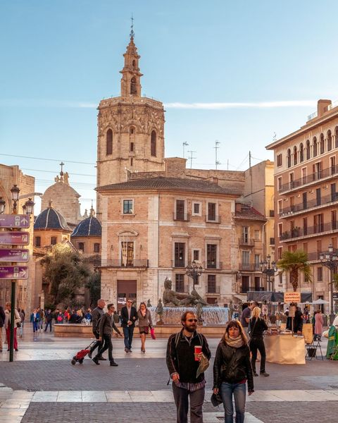 People crossing a plaza in Valencia